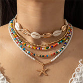 Bohemian multi-layered shell and rice bead necklace