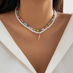 Bohemian multi-layered shell and rice bead necklace