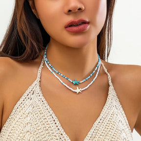 Bohemian multi-layered shell and rice bead necklace