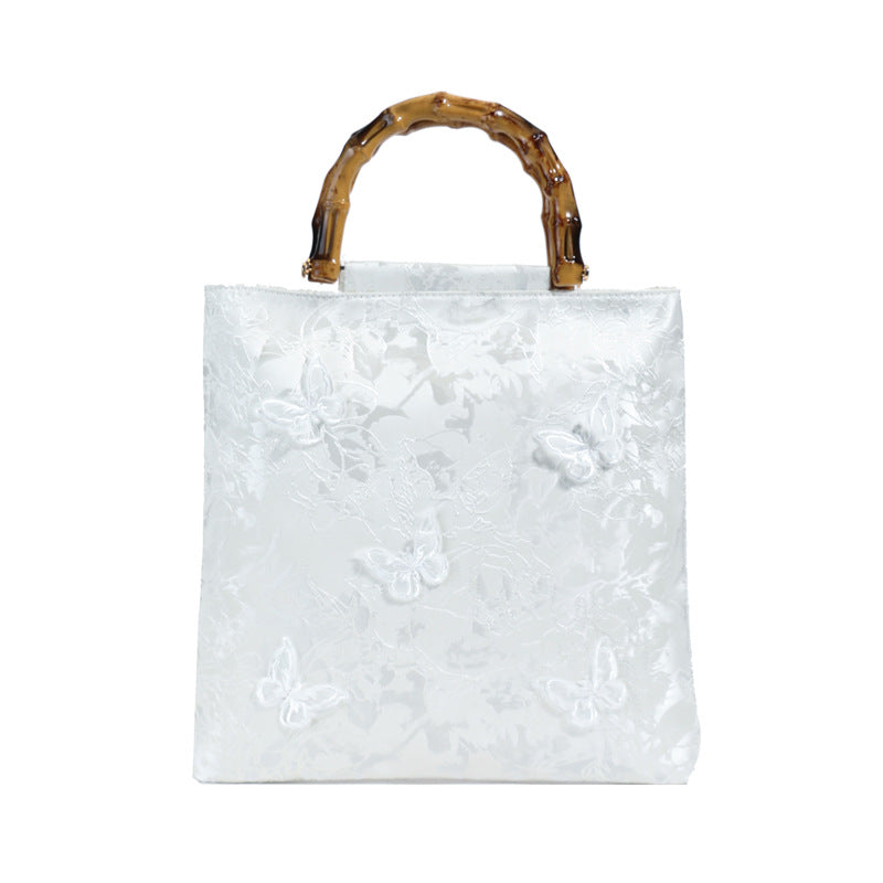 Embroidered sequins linen bamboo handle tote bag
