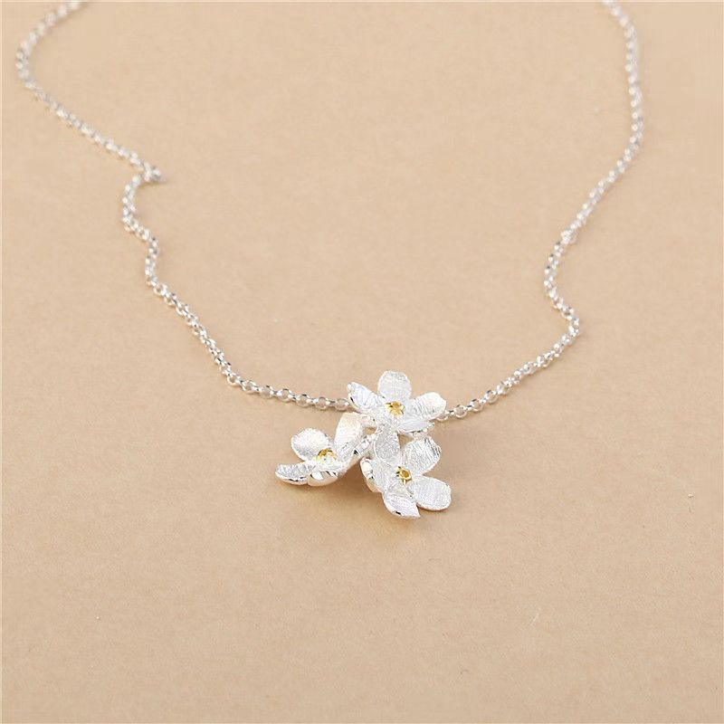 triangle forget me not necklace