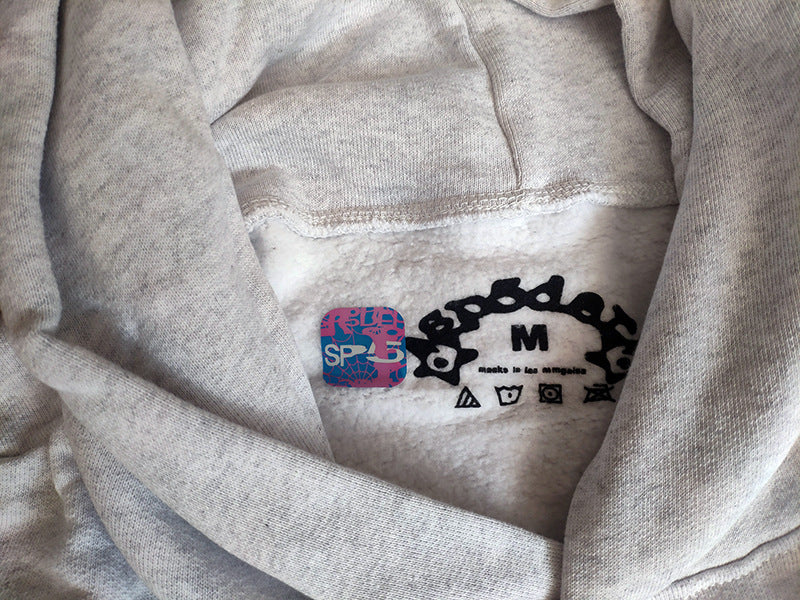 Sp5der fleece-lined hoodie with spiderweb print.