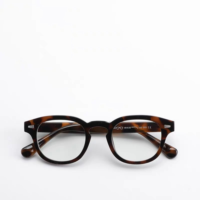 Thick-rimmed round transparent glasses