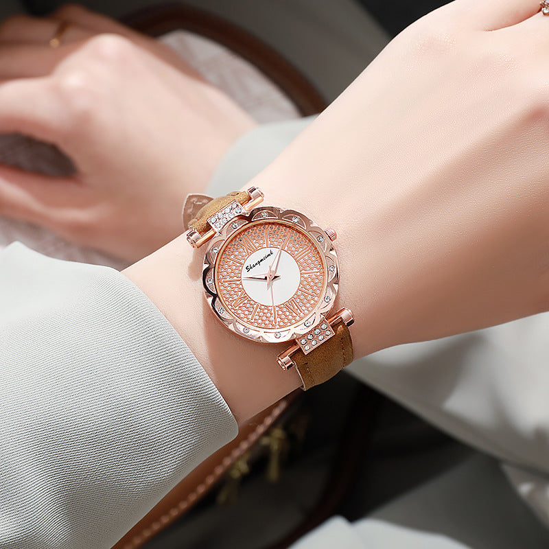 Korean-style quartz watch with a simple leather strap.