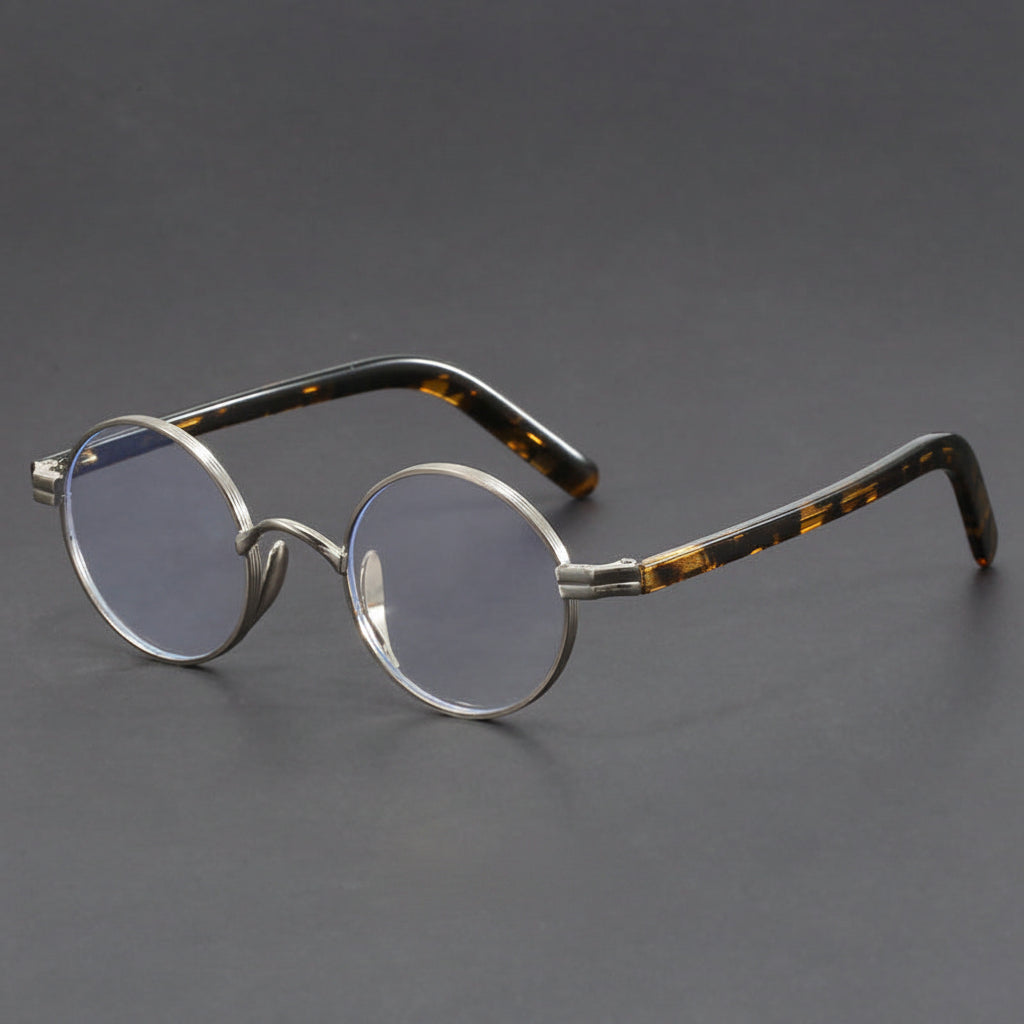 Small round gold-rimmed eyeglasses