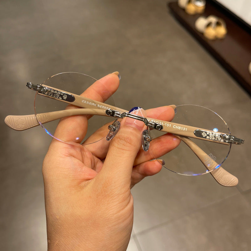 Chrome Hearts frameless round punched retro glasses