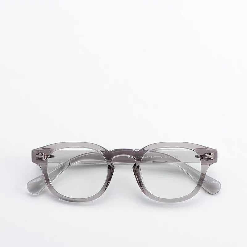 Thick-rimmed round transparent glasses