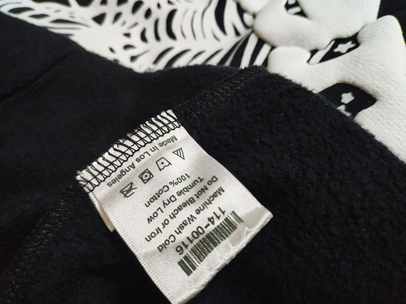 Sp5der fleece-lined hoodie with spiderweb print.