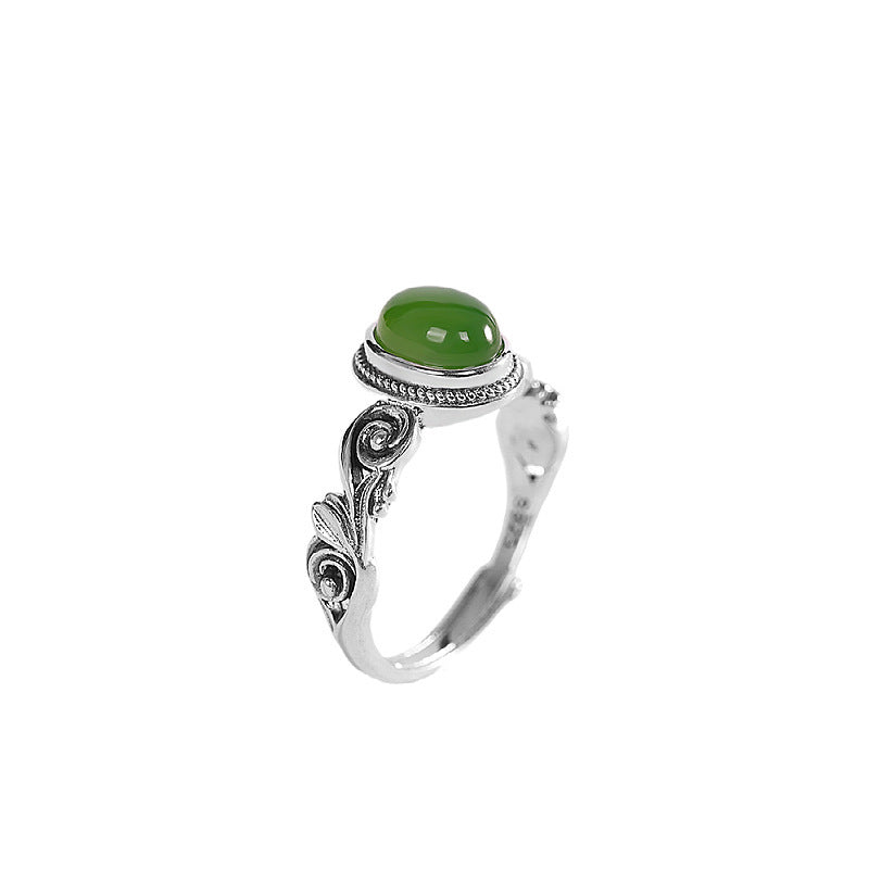 Egg-shaped red and green stone ring