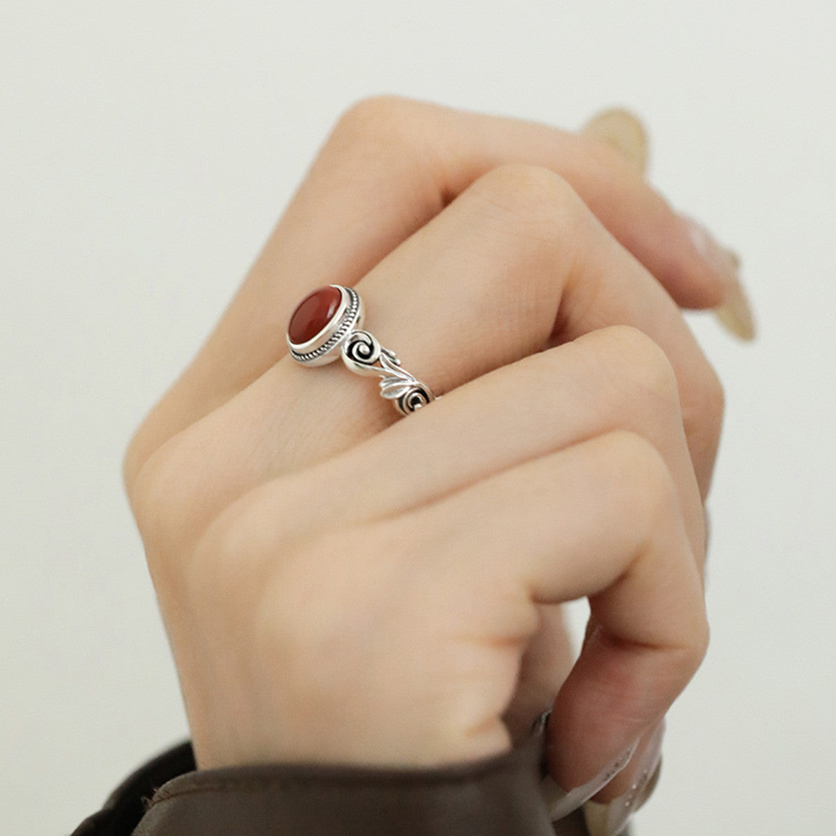 Egg-shaped red and green stone ring