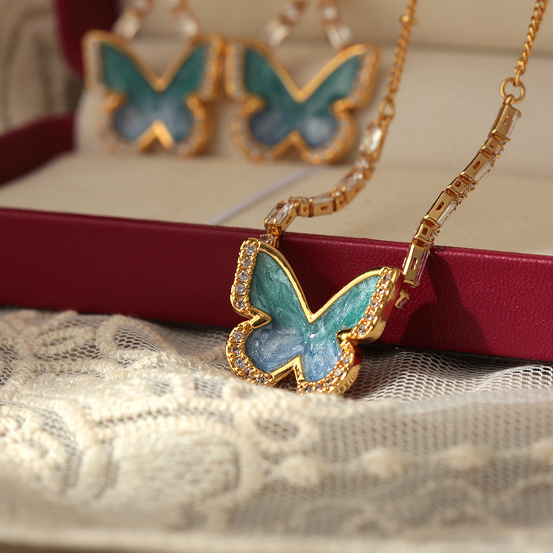 Gradient blue enamel butterfly necklace