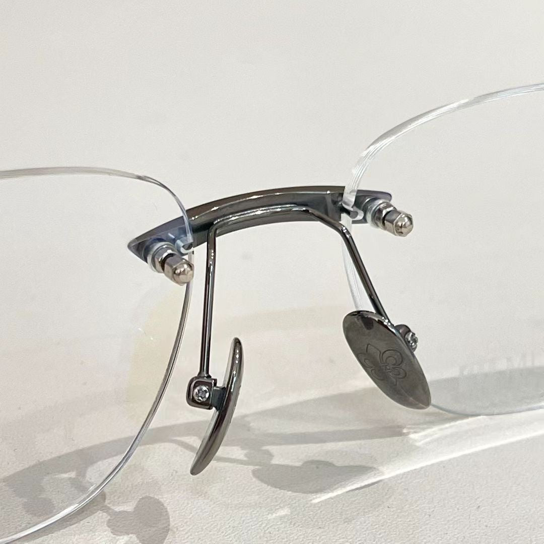 Chrome Hearts rimless oval frame glasses