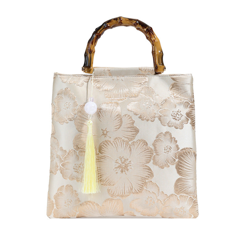 Embroidered sequins linen bamboo handle tote bag