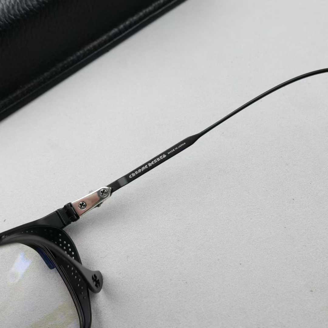 Chrome Hearts thick rimmed hollow out glasses with gold colored legs