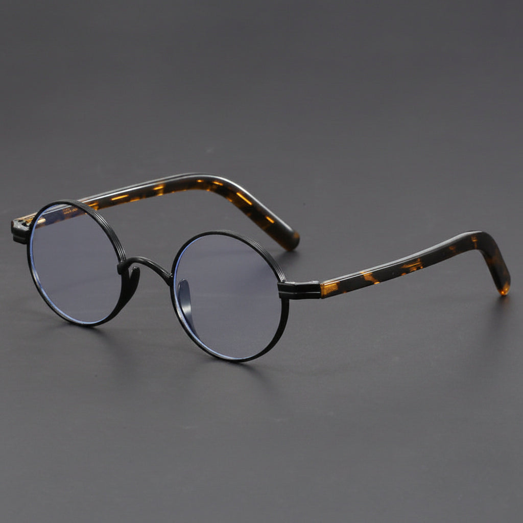 Small round gold-rimmed eyeglasses