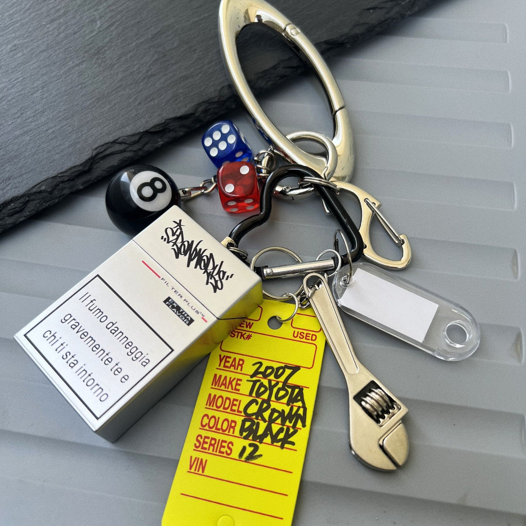 Multi-Element Keychain: Ashtray, Dice, and Wrench