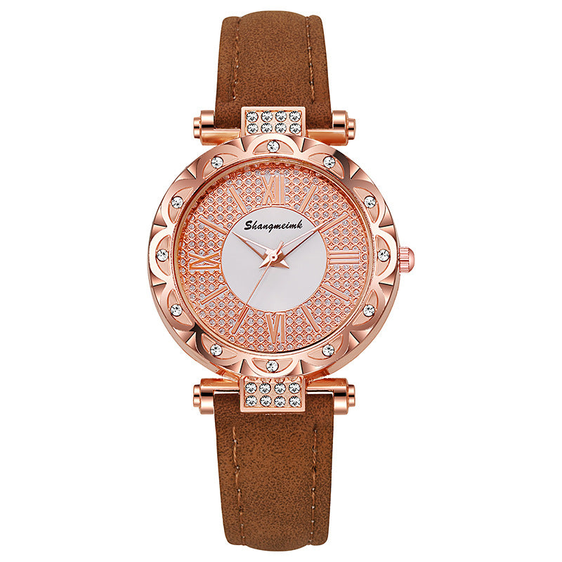 Korean-style quartz watch with a simple leather strap.