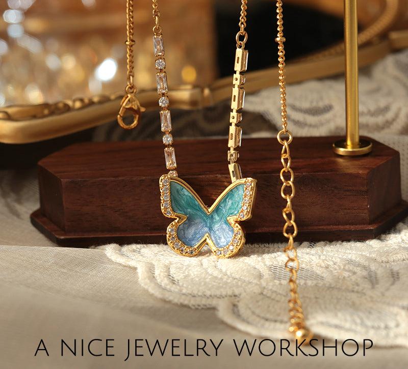 Gradient blue enamel butterfly necklace