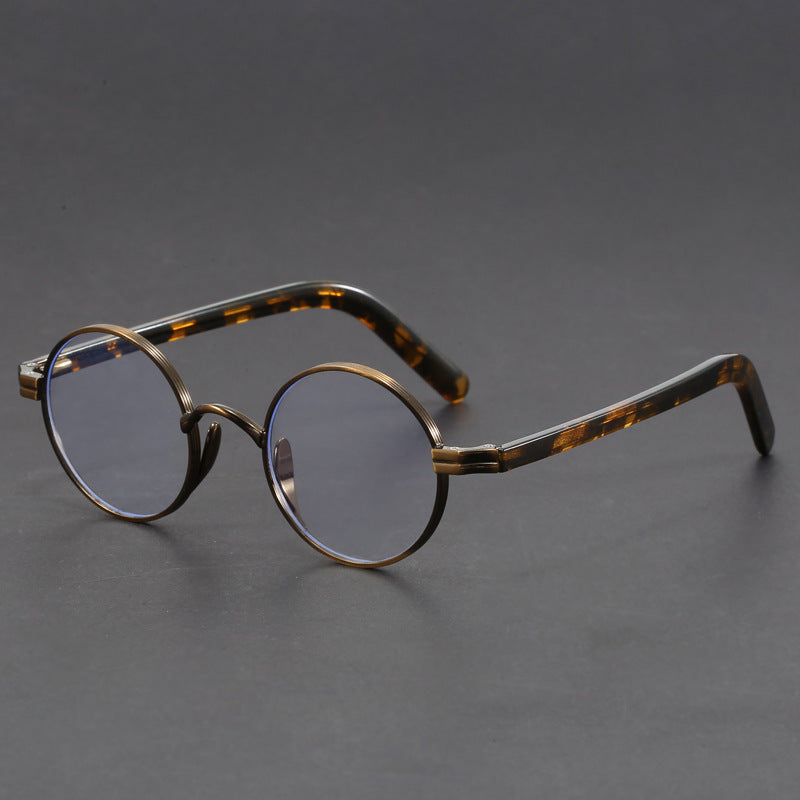 Small round gold-rimmed eyeglasses