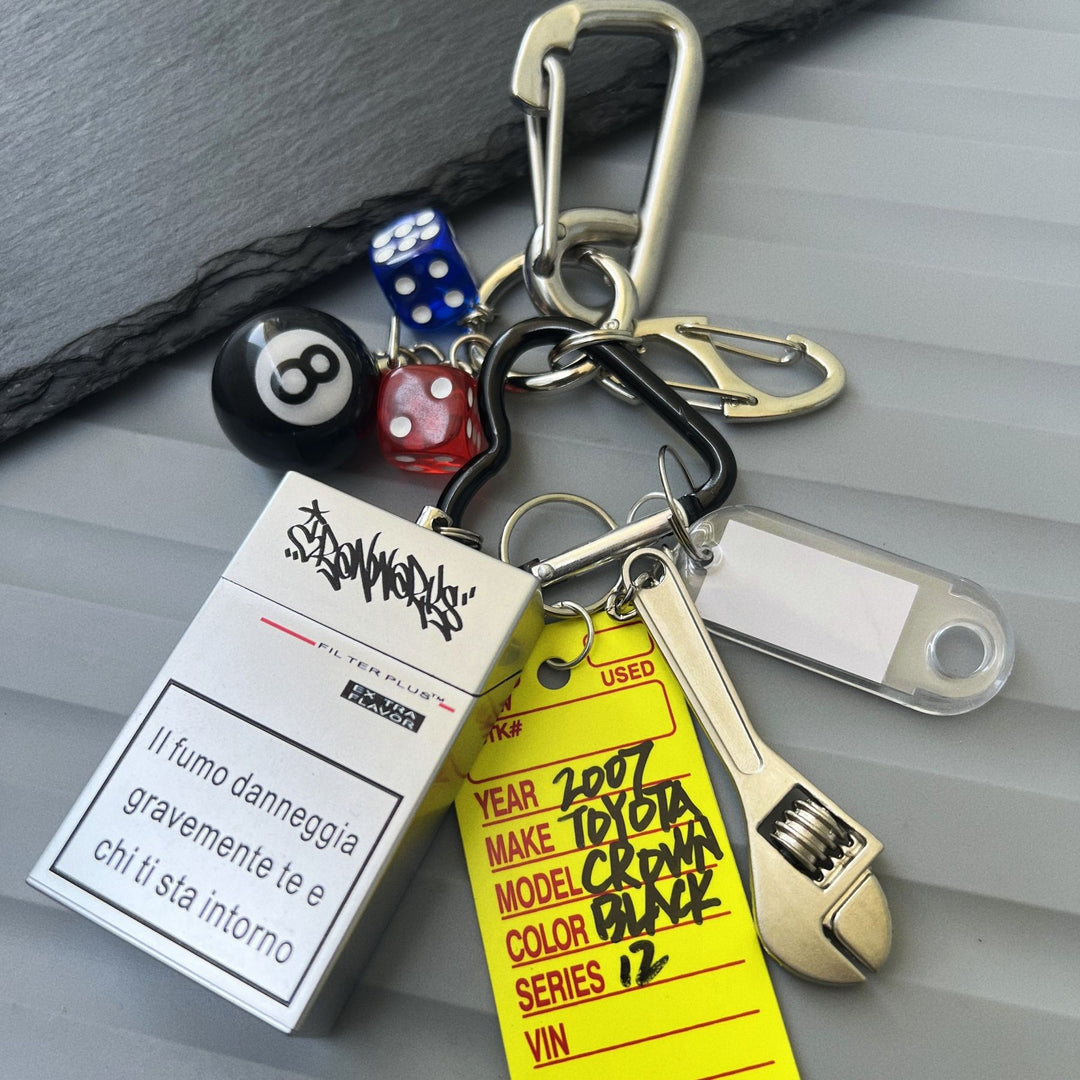 Multi-Element Keychain: Ashtray, Dice, and Wrench