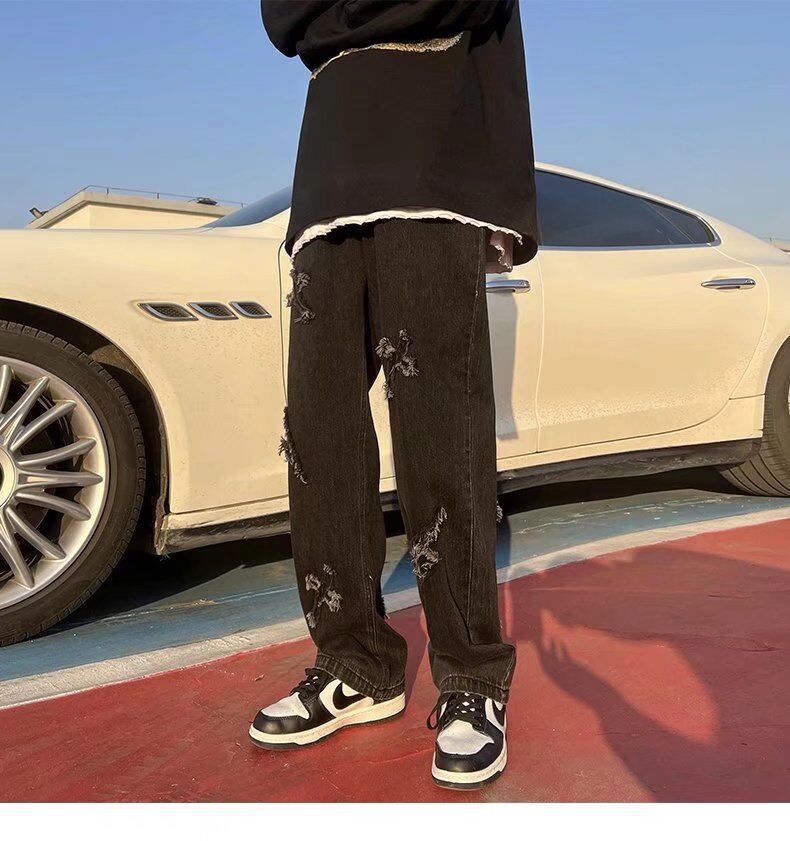 Cross patchwork jeans with frayed hem.