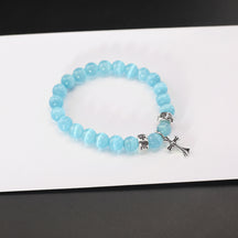 chrome hearts blue cat's eye stone cross bracelet