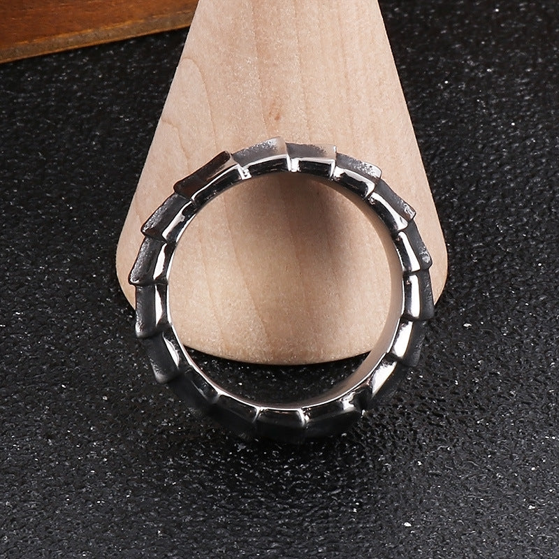 Distressed, minimalist, and stylish dragon-shaped diamond ring