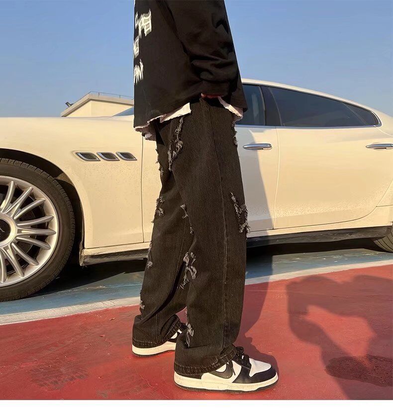 Cross patchwork jeans with frayed hem.