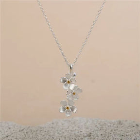 triangle forget me not necklace