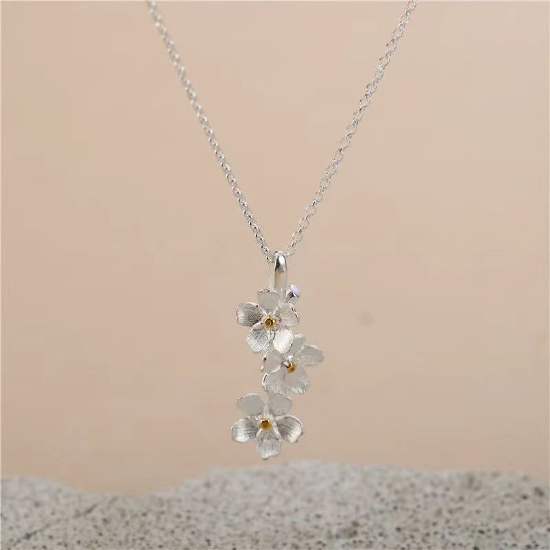 triangle forget me not necklace